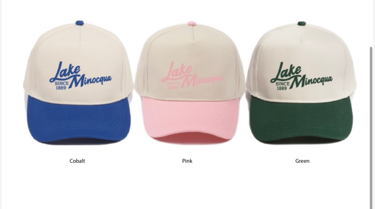 Three baseball caps in different colors with text on a white background