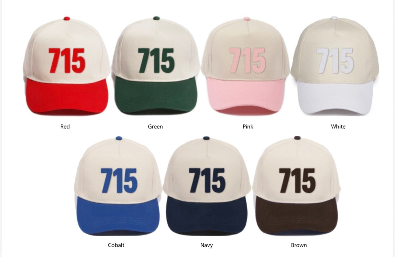 Collection of baseball caps with numbers and text in various colors on a white background.