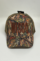 Camouflage cap with 'WISCO' branding on a white background