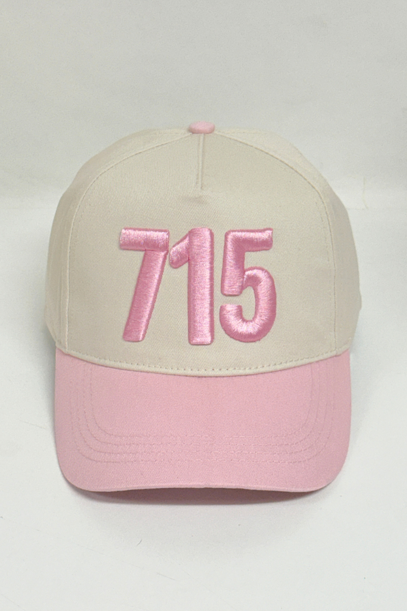 Beige and pink cap with '715' embroidery on a light gray background
