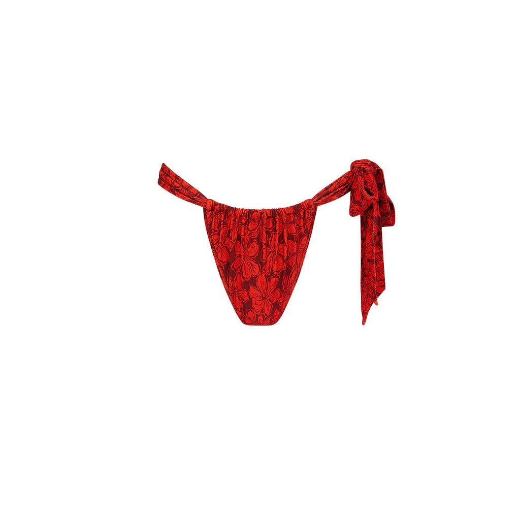 Red floral tie-side bikini bottom with adjustable side straps and high-cut silhouette, shown on a white background.