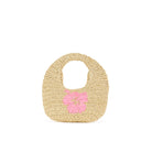 Beige straw bag with a pink flower on a white background
